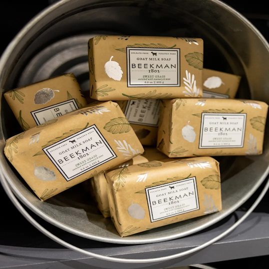 A bucket full of Beekman 1802 bars of soap for sale.